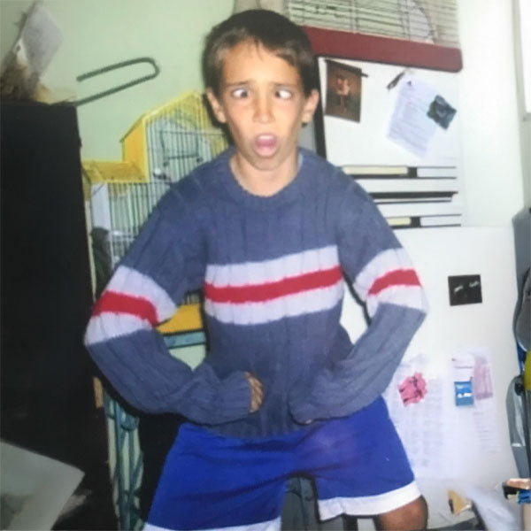 A boy posing and making a funny face