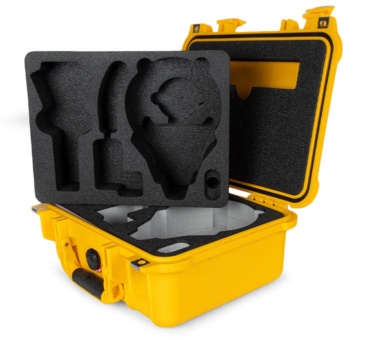 A yellow Peli Protector Case with its lid open containing a black custom foam base insert with grey pockets, a letterbox lid insert and a separate black insert sat on top of the base insert inside the case.